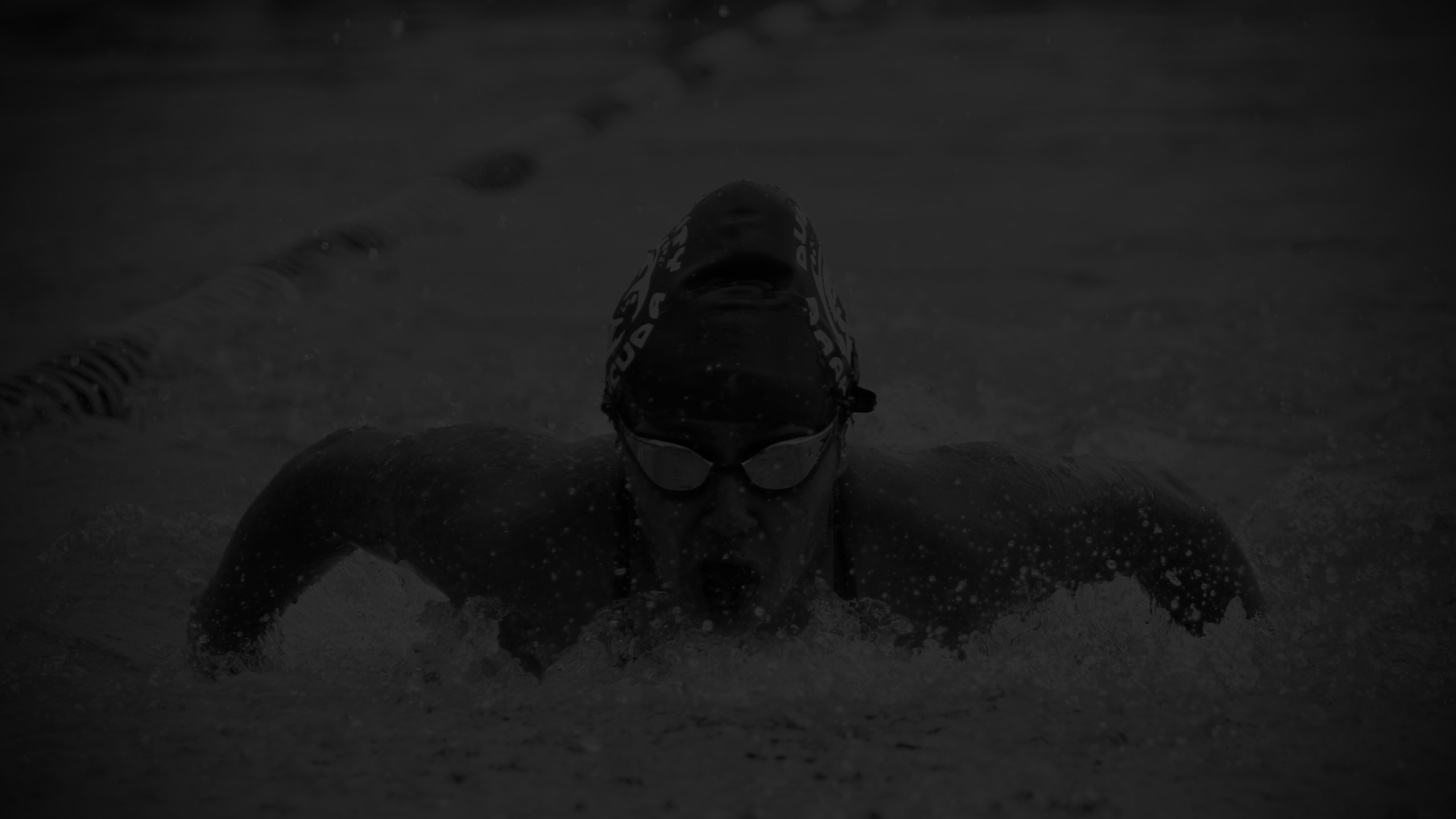 Hero for EnetAnalytics. Picture of swimmer competing.