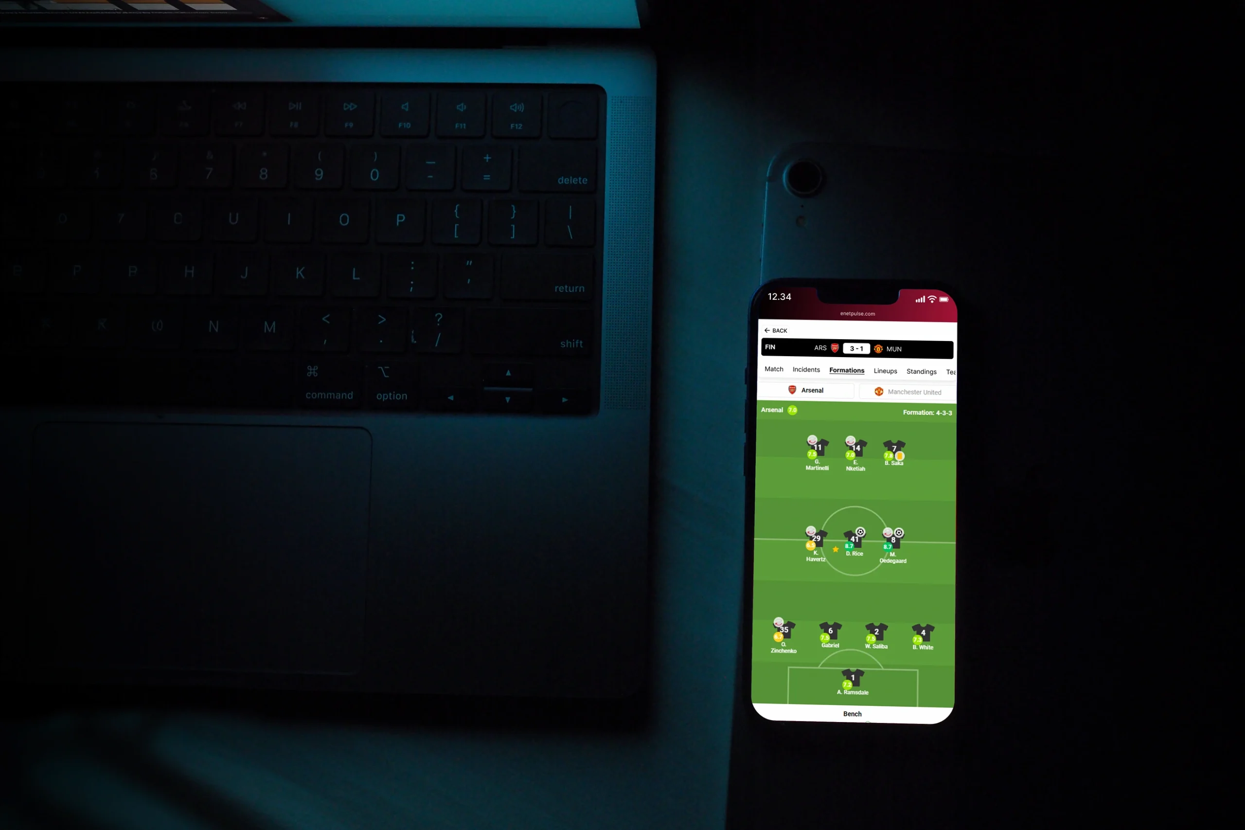 Iphone showcasing a football lineup widget